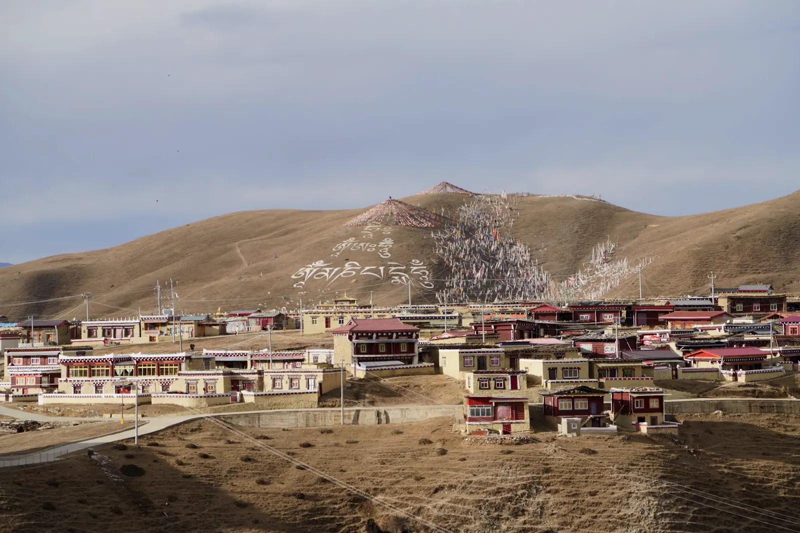 A small Tibetan village on a scrubby hillside